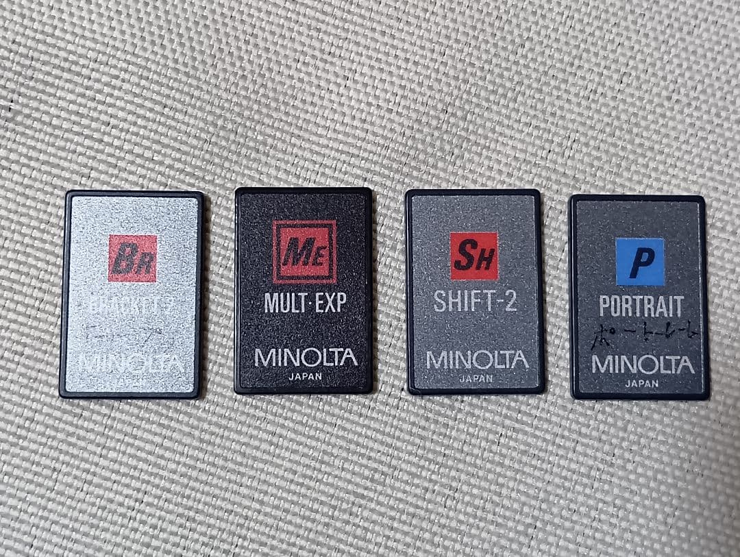 ミノルタ フィルム一眼レフカメラα-7xi + フラッシュ + 単焦点レンズほか
